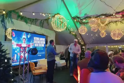 Outdoor event with full audio and visual setup at night
